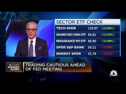 Stocks hover around record highs as Wall Street awaits guidance from the Fed